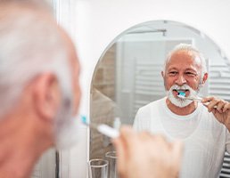 A man brushing his teeth