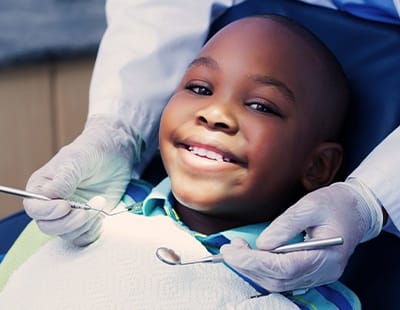 Little boy receiving children's dentistry exam