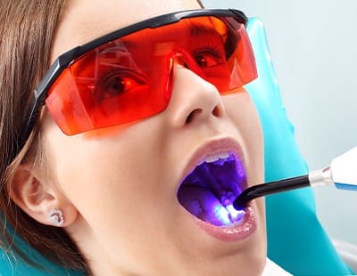 Patient receiving dental sealants