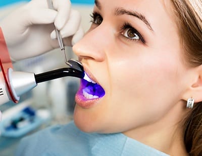 Woman receiving cosmetic dental bonding