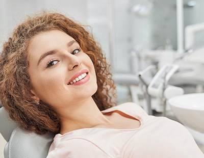 Female patient smiling after cosmetic dentistry in Ellicott City, MD