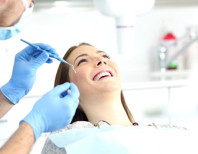Ellicott City cosmetic dentist applying dental bonding for patient