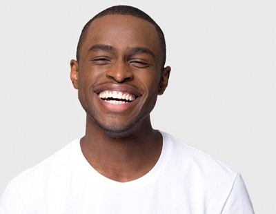 Smiling man with beautiful teeth thanks to cosmetic dental bonding in Ellicott City