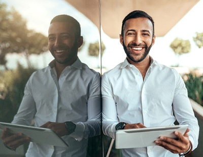 a businessperson holding a tablet