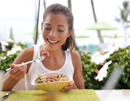 a woman with dentures eating a healthy meal