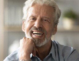 Man smiling with dentures