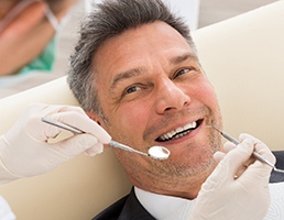 Man smiling at dentist in Ellicott City