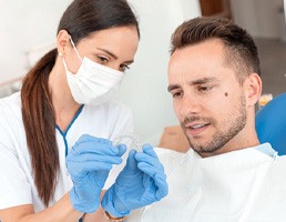Patient with dentist in Ellicott City talking about Invisalign