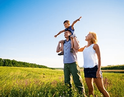 family outside enjoying the sun