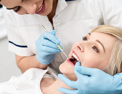 Patient receiving preventive dentistry checkup