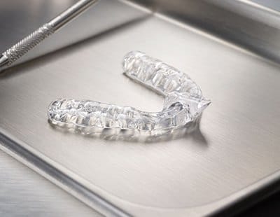 Clear nightguard for bruxism on metal tray