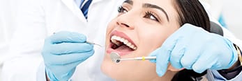 Woman receiving preventive dentistry exam