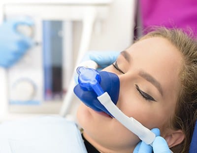 Woman with nitrous oxide sedation dentistry mask